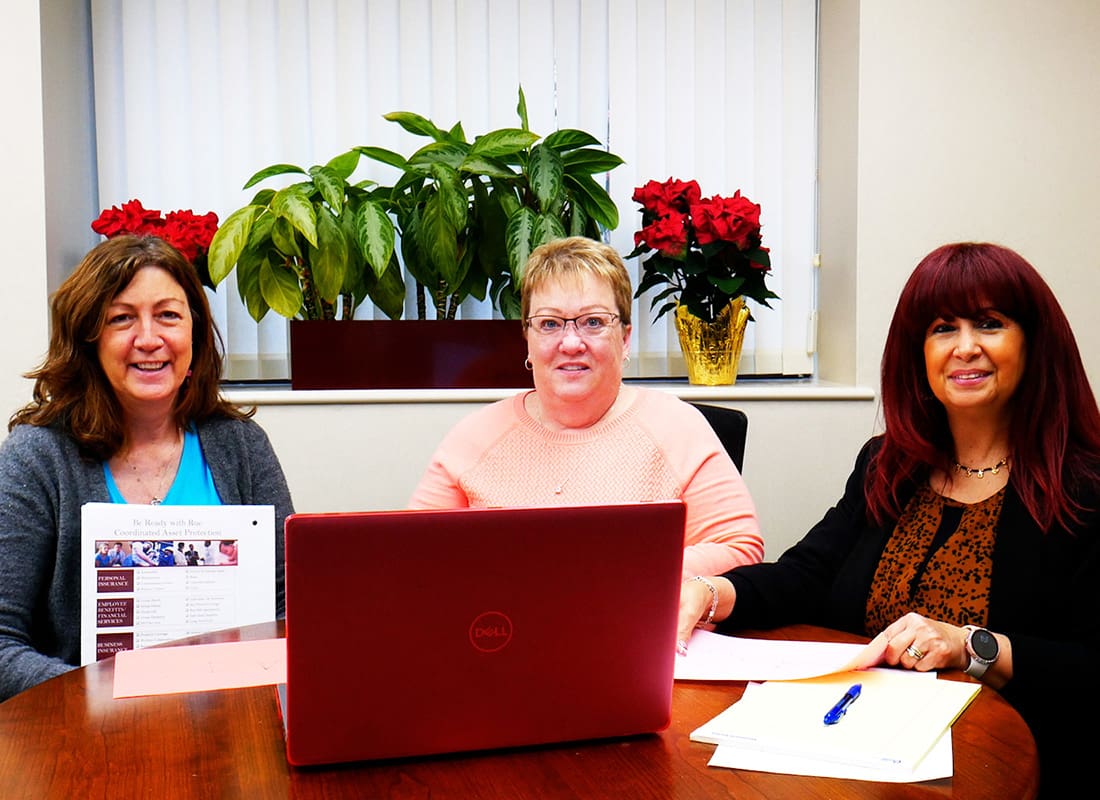 We Are Independent - Three Smiling Women Training at the Rue Insurance Office